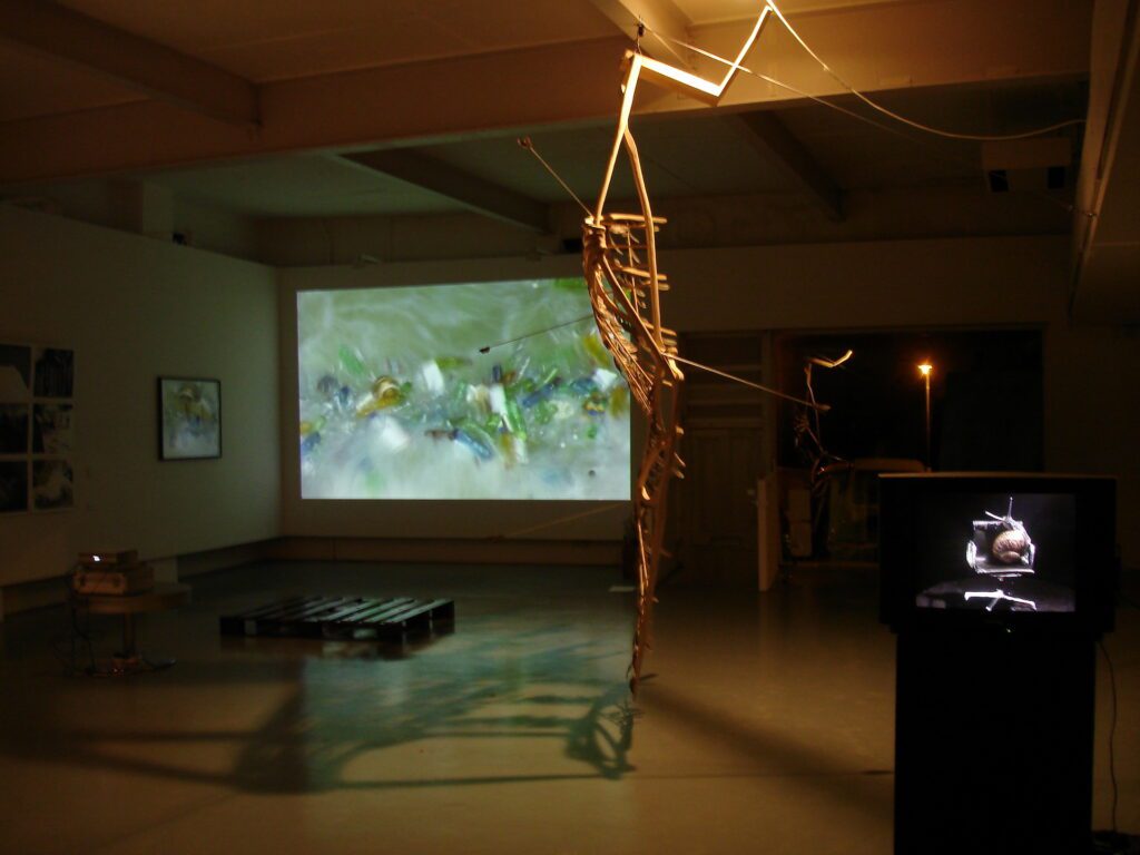 ‘Revolver' - John Nielsen - sculpture , Hadrian Pigott - video and Rupert White - monitor